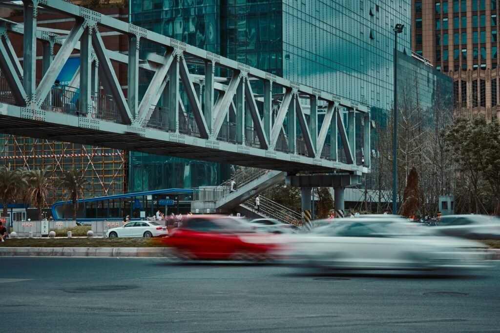 city, road, traffic, footbridge, cars, vehicles, speed, fast, pedestrian bridge, pedestrian overpass, street, urban, buildings, traffic, cars, speed, speed, speed, fast, fast, fast, fast, fast, street